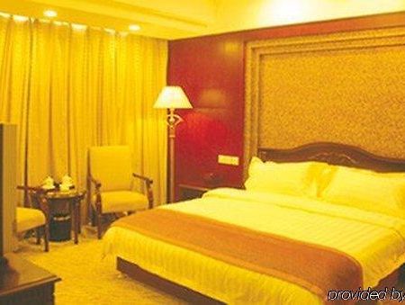 Tian Cheng Grand Hotel Жичжао Номер фото