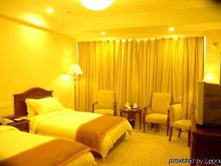 Tian Cheng Grand Hotel Жичжао Номер фото