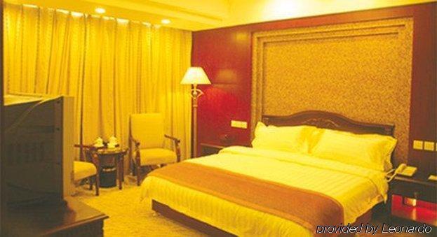 Tian Cheng Grand Hotel Жичжао Номер фото