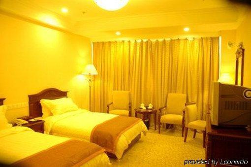 Tian Cheng Grand Hotel Жичжао Номер фото